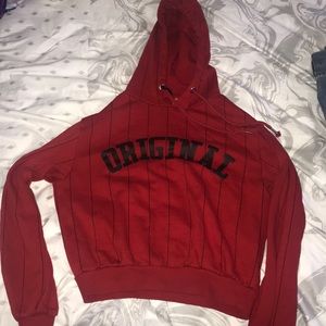 Red shirt jacket that says “original”